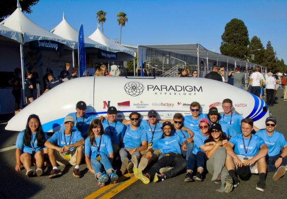 The Paradigm Hyperloop team poses with their pod. 