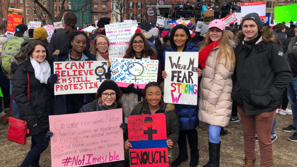 Members of the Social Impact Honors LLC attend the Women's March 2019