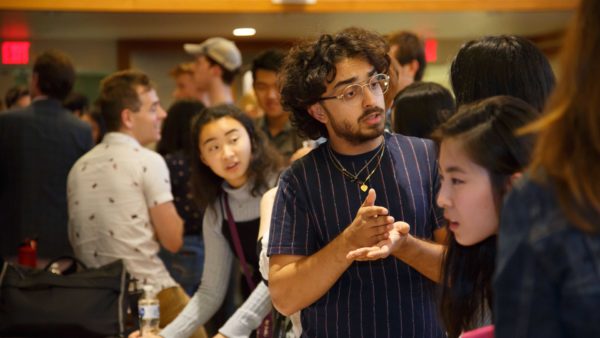 Students and faculty talk at SOURCE