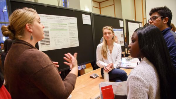 Students and faculty talk at SOURCE