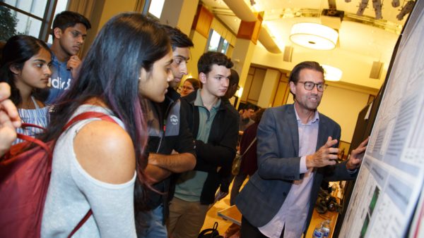 Students and faculty talk at SOURCE